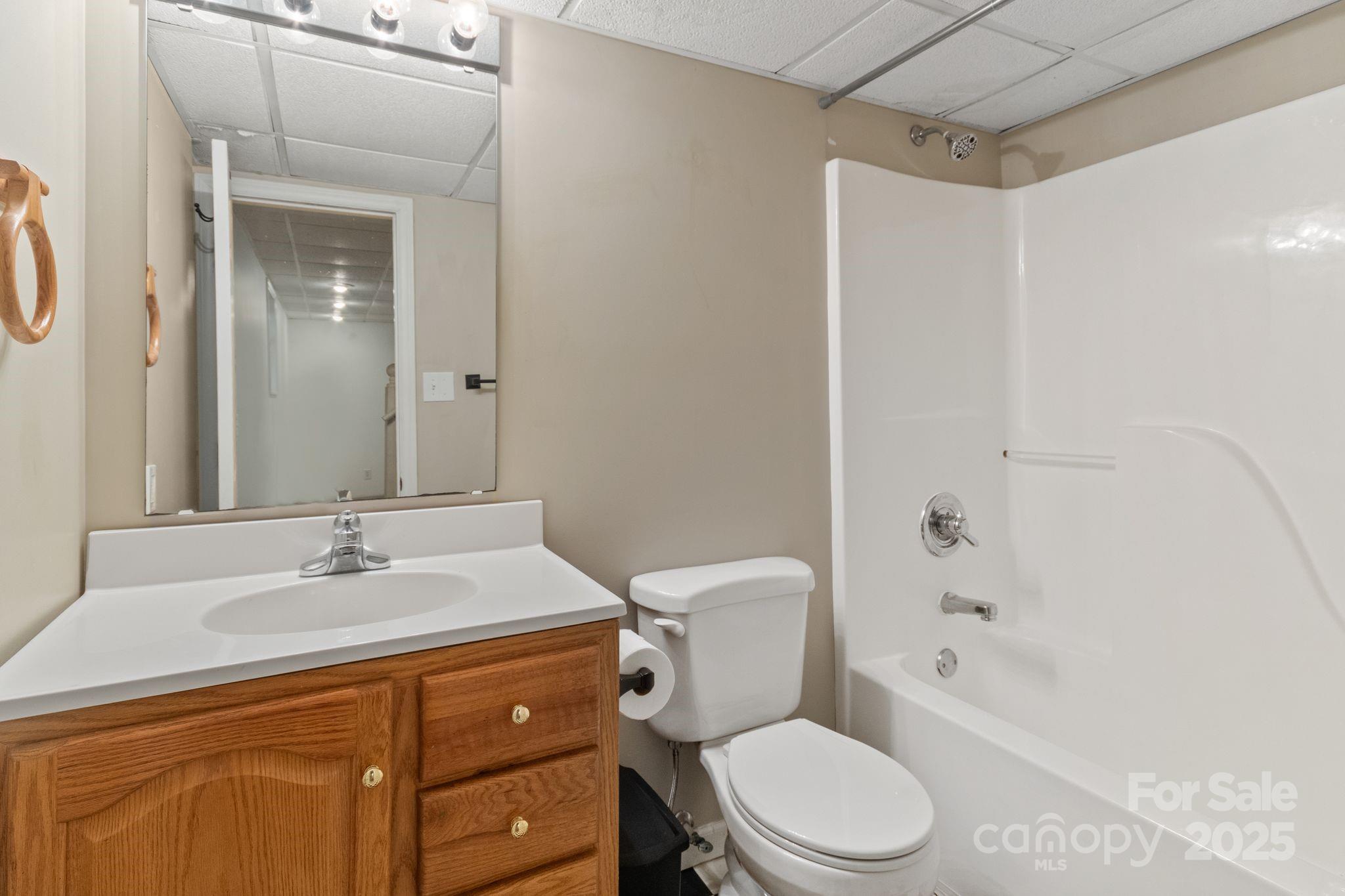 14 South Ridge Place Arden, NC 28704 - Photo 24 of 32 a bathroom with a sink toilet and shower