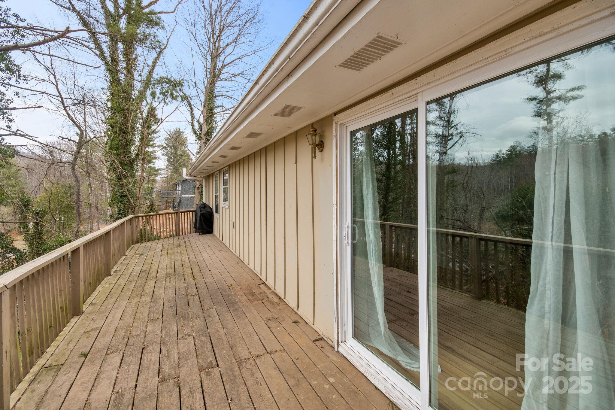 14 South Ridge Place Arden, NC 28704 - Photo 30 of 32 a view of balcony with floor to ceiling window and wooden floor
