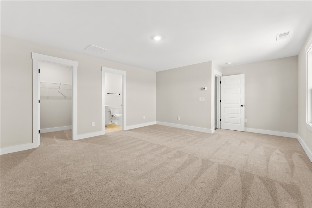 334 Summerall Drive Anderson, SC 29621 - Photo 15 of 28 This spacious room offers comfort and versatility, featuring soft carpeting and bright, neutral walls.