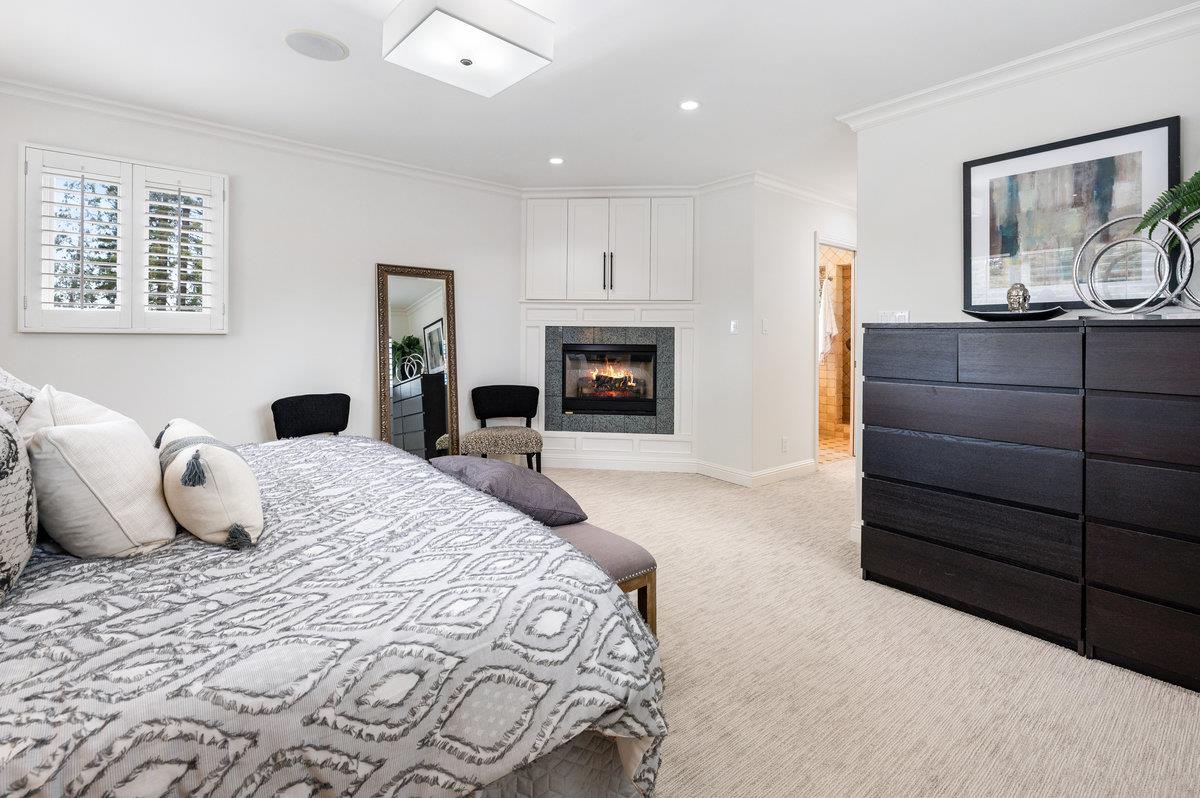 3524 Michael Drive San Mateo, CA 94403 - Photo 19 of 39 a bedroom with a large bed and a chandelier