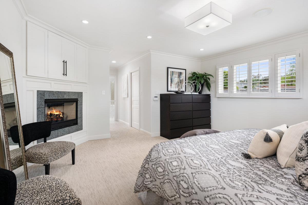 3524 Michael Drive San Mateo, CA 94403 - Photo 20 of 39 a bedroom with a bed and a fireplace