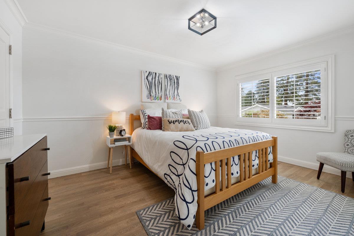 3524 Michael Drive San Mateo, CA 94403 - Photo 23 of 39 a bedroom with a bed and a table in it