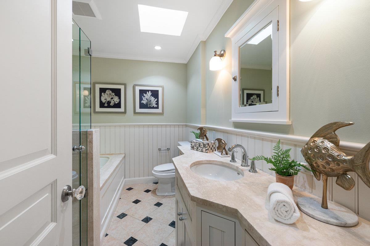 3524 Michael Drive San Mateo, CA 94403 - Photo 25 of 39 a bathroom with a granite countertop sink a mirror and shower