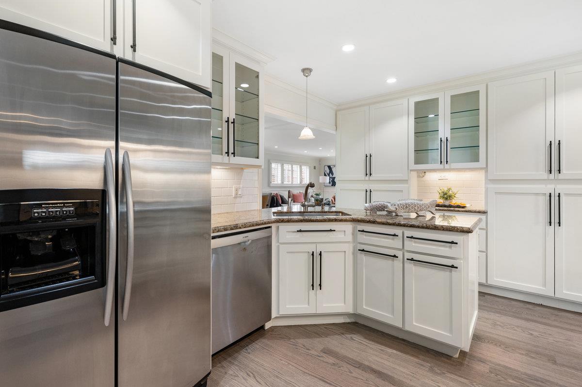3524 Michael Drive San Mateo, CA 94403 - Photo 6 of 39 a kitchen with a refrigerator sink and cabinets