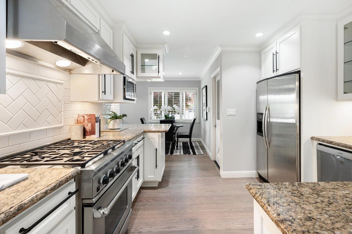 3524 Michael Drive San Mateo, CA 94403 - Photo 7 of 39 a kitchen with stainless steel appliances granite countertop a stove and a refrigerator
