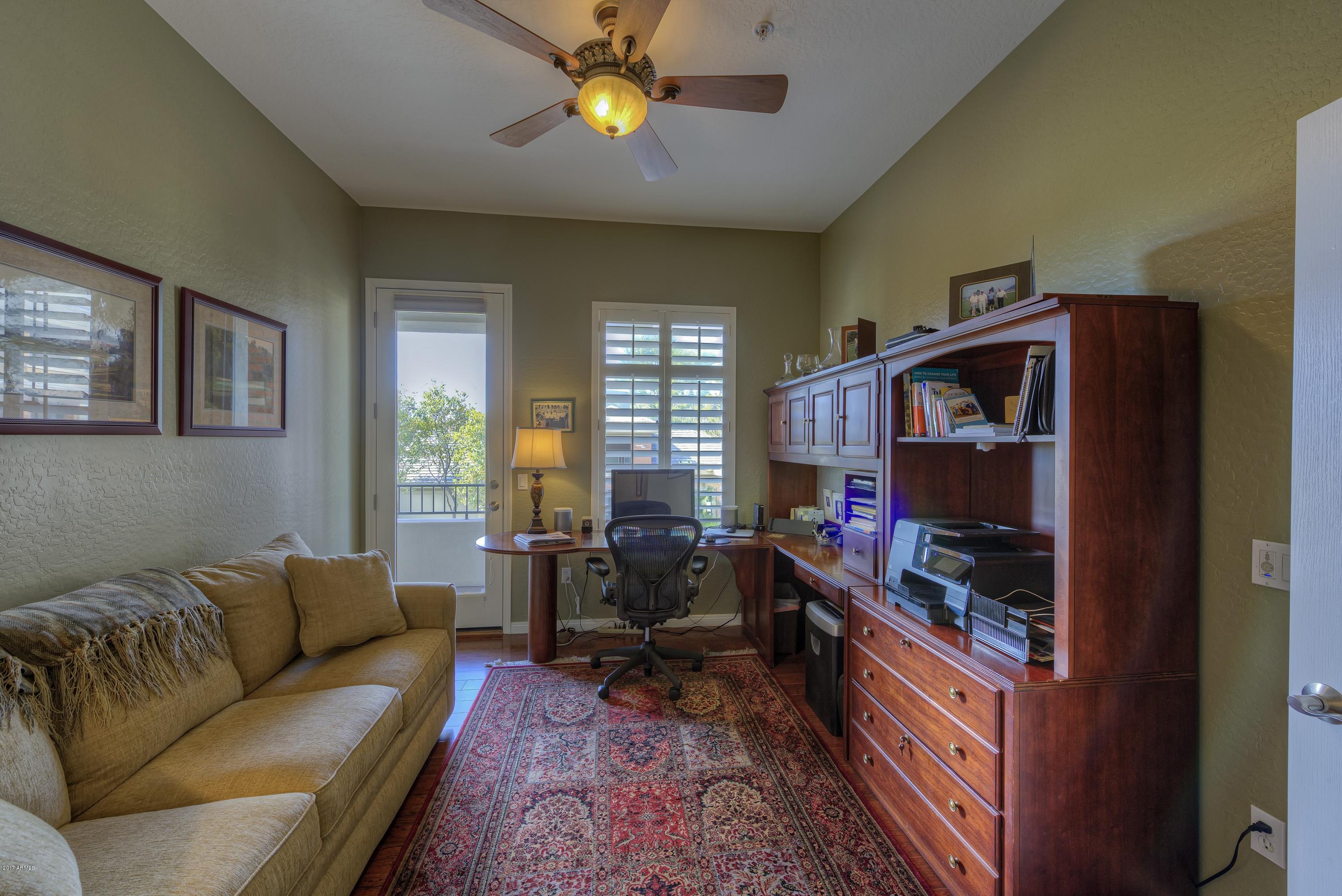 4488 East Thomas Road, Unit 2046 Phoenix, AZ 85018 - Photo 13 of 18 a living room with furniture and a window