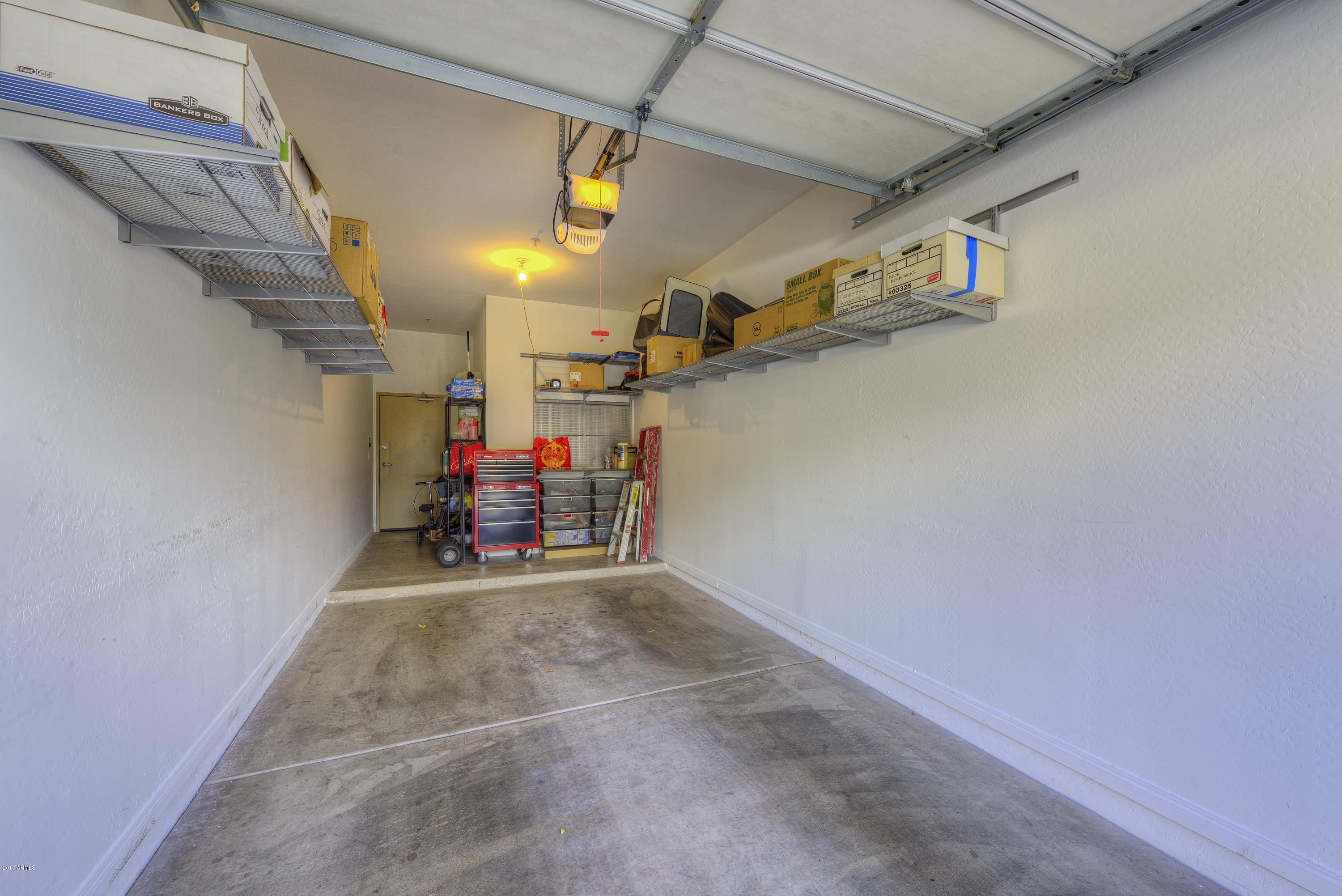 4488 East Thomas Road, Unit 2046 Phoenix, AZ 85018 - Photo 16 of 18 a view of a garage with furniture
