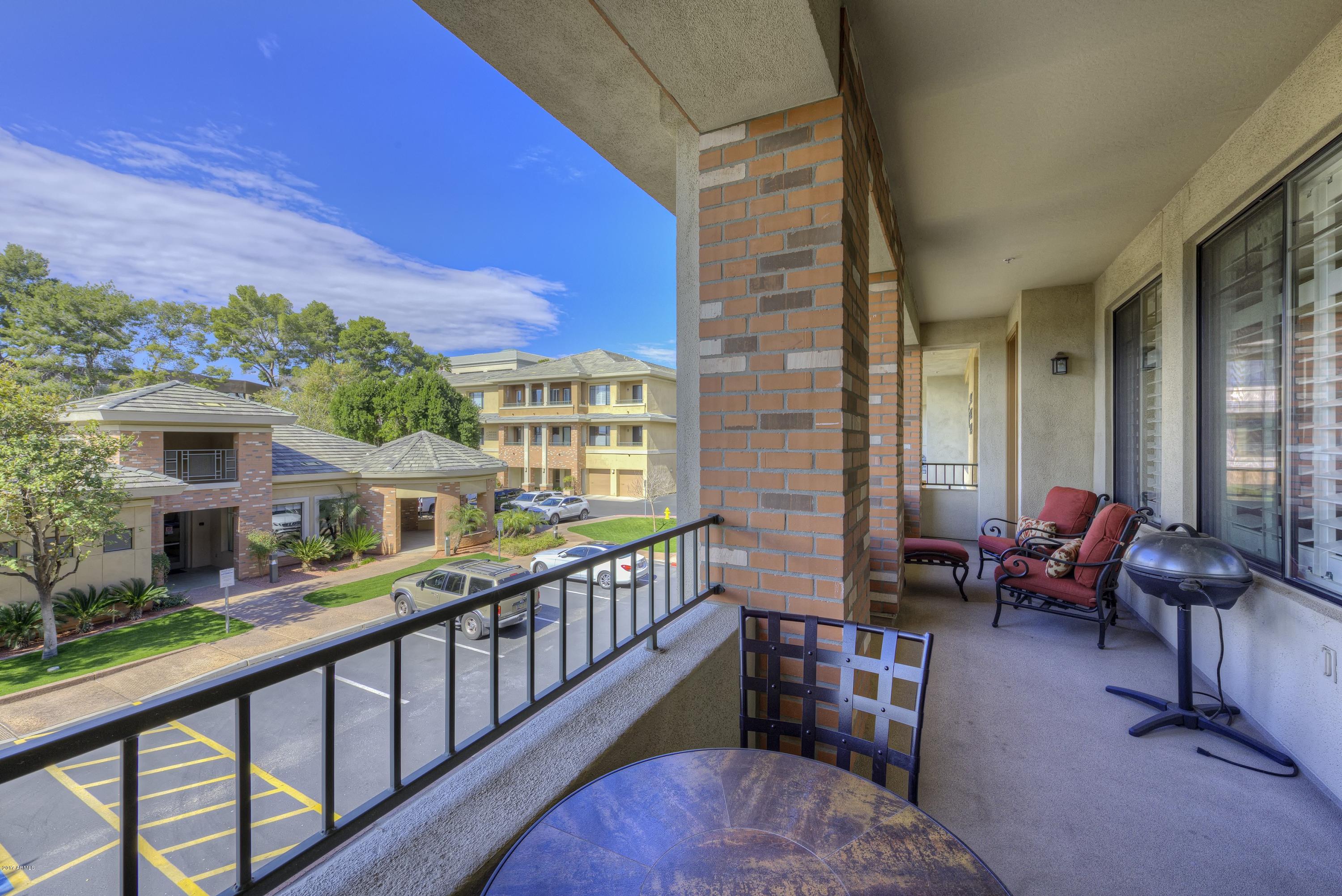 4488 East Thomas Road, Unit 2046 Phoenix, AZ 85018 - Photo 10 of 18 a balcony with furniture and a potted plant