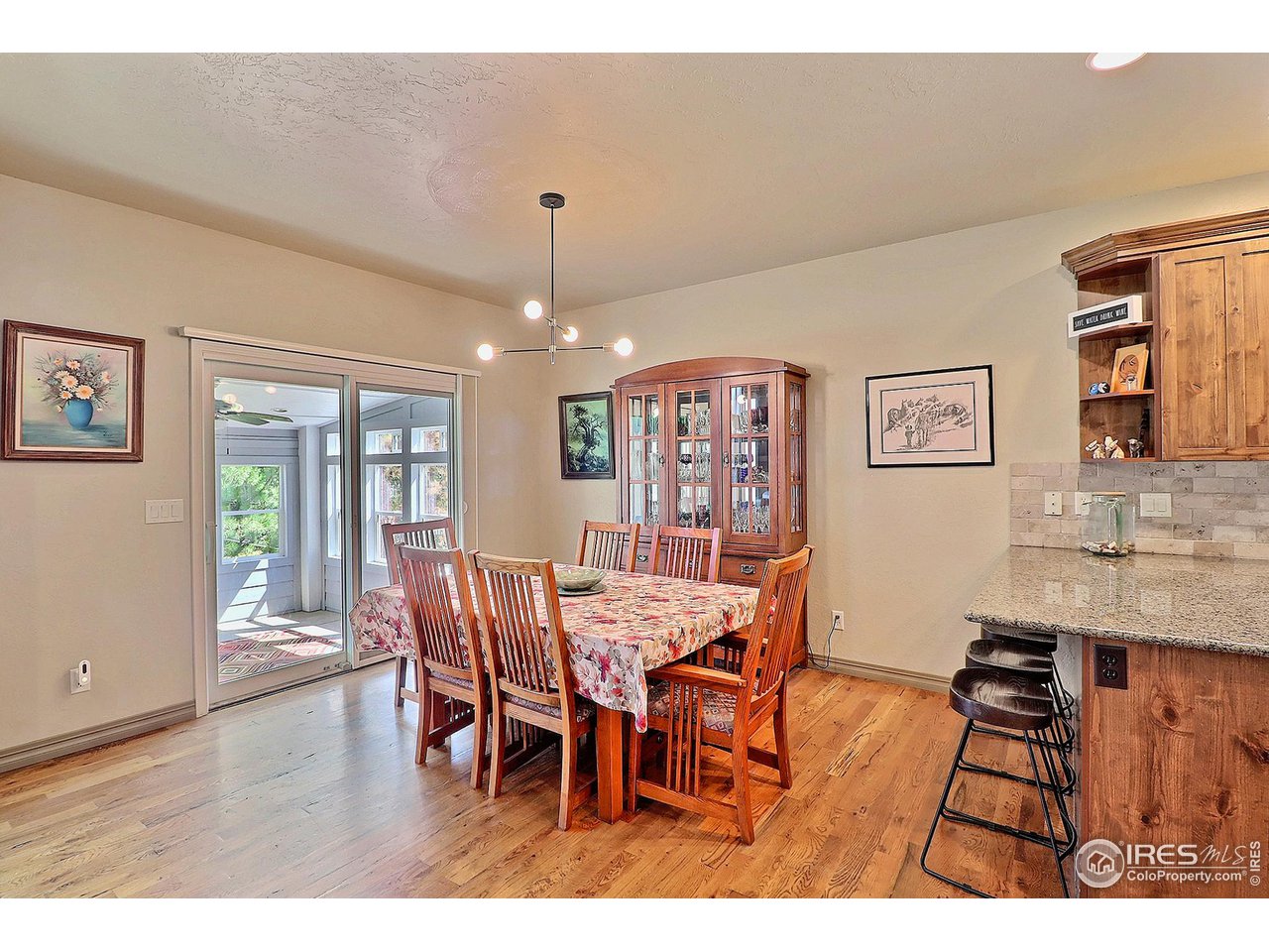 6801 West 34th St Road Greeley, CO 80634 - Photo 11 of 40 a view of a dining room with furniture window and wooden floor