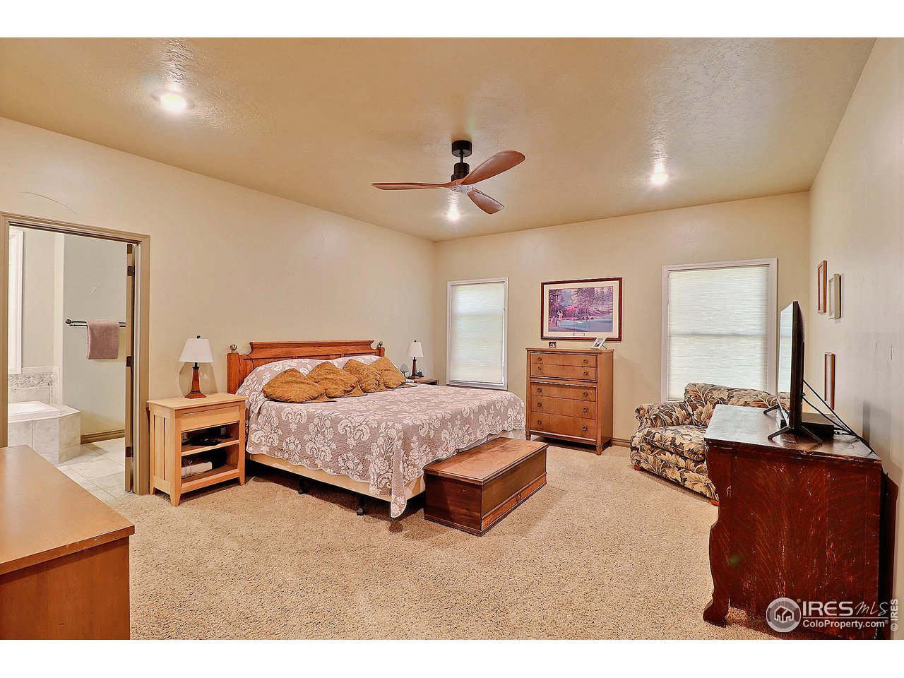 6801 West 34th St Road Greeley, CO 80634 - Photo 17 of 40 a bedroom with furniture and wooden floor