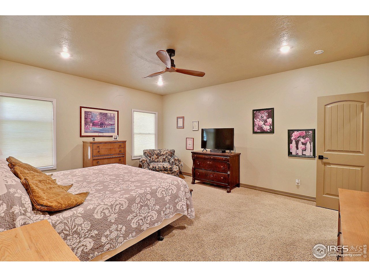6801 West 34th St Road Greeley, CO 80634 - Photo 18 of 40 a bedroom with a bed and a flat screen tv