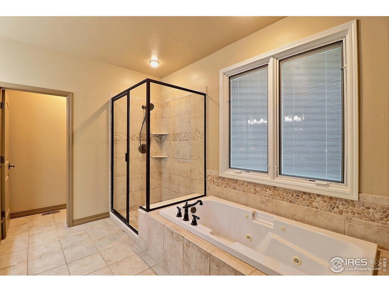 6801 West 34th St Road Greeley, CO 80634 - Photo 20 of 40 a bathroom with a bathtub and a sink