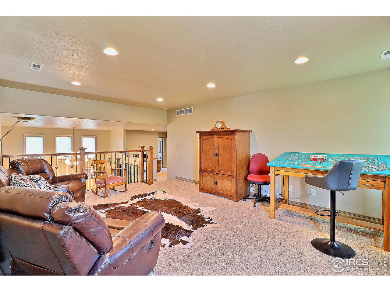 6801 West 34th St Road Greeley, CO 80634 - Photo 25 of 40 a living room with furniture and a table