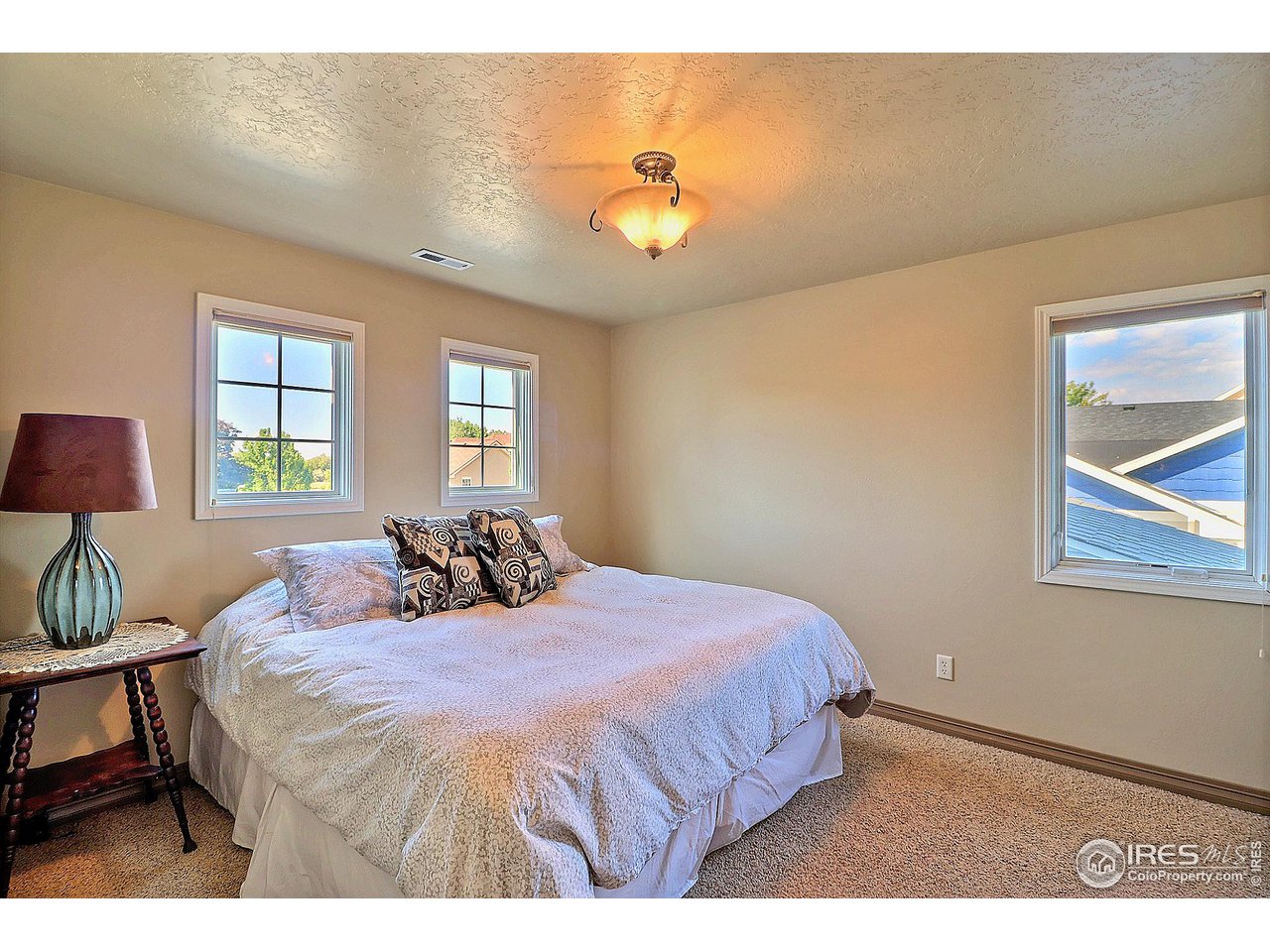 6801 West 34th St Road Greeley, CO 80634 - Photo 27 of 40 a bed sitting in a bedroom next to a window