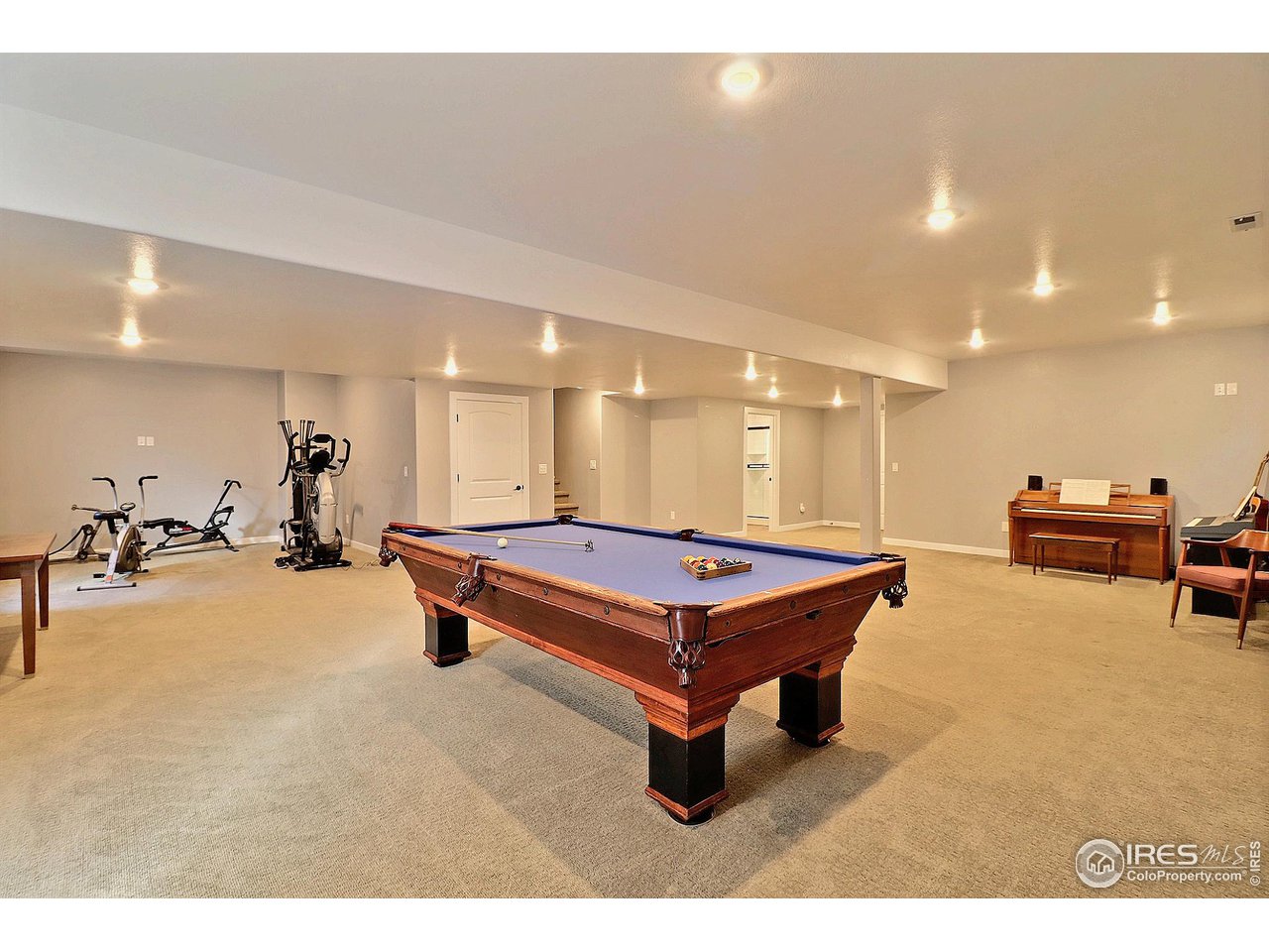 6801 West 34th St Road Greeley, CO 80634 - Photo 32 of 40 a room with pool tables and couches