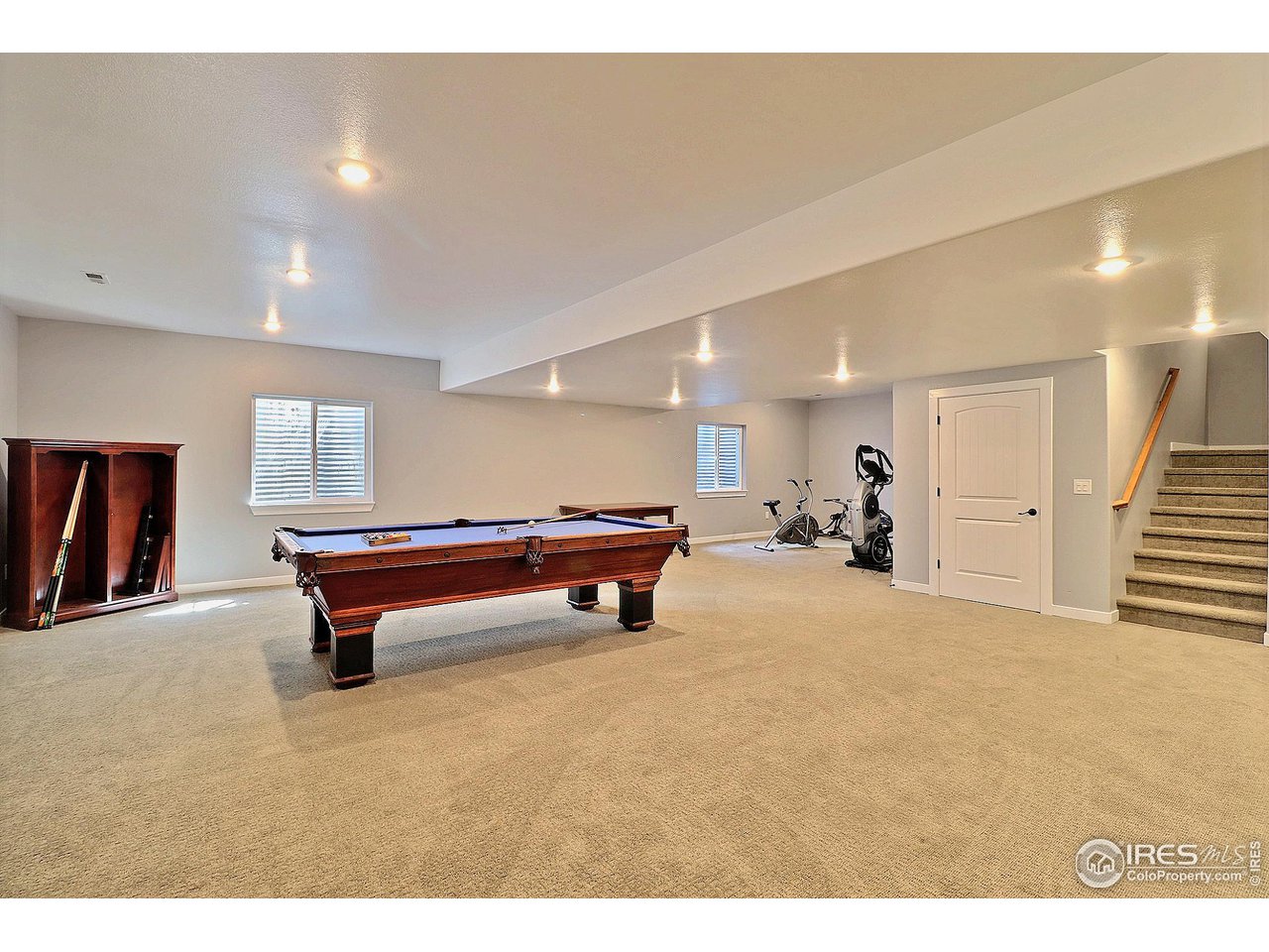 6801 West 34th St Road Greeley, CO 80634 - Photo 33 of 40 a room with pool table gym equipment mirrors and window