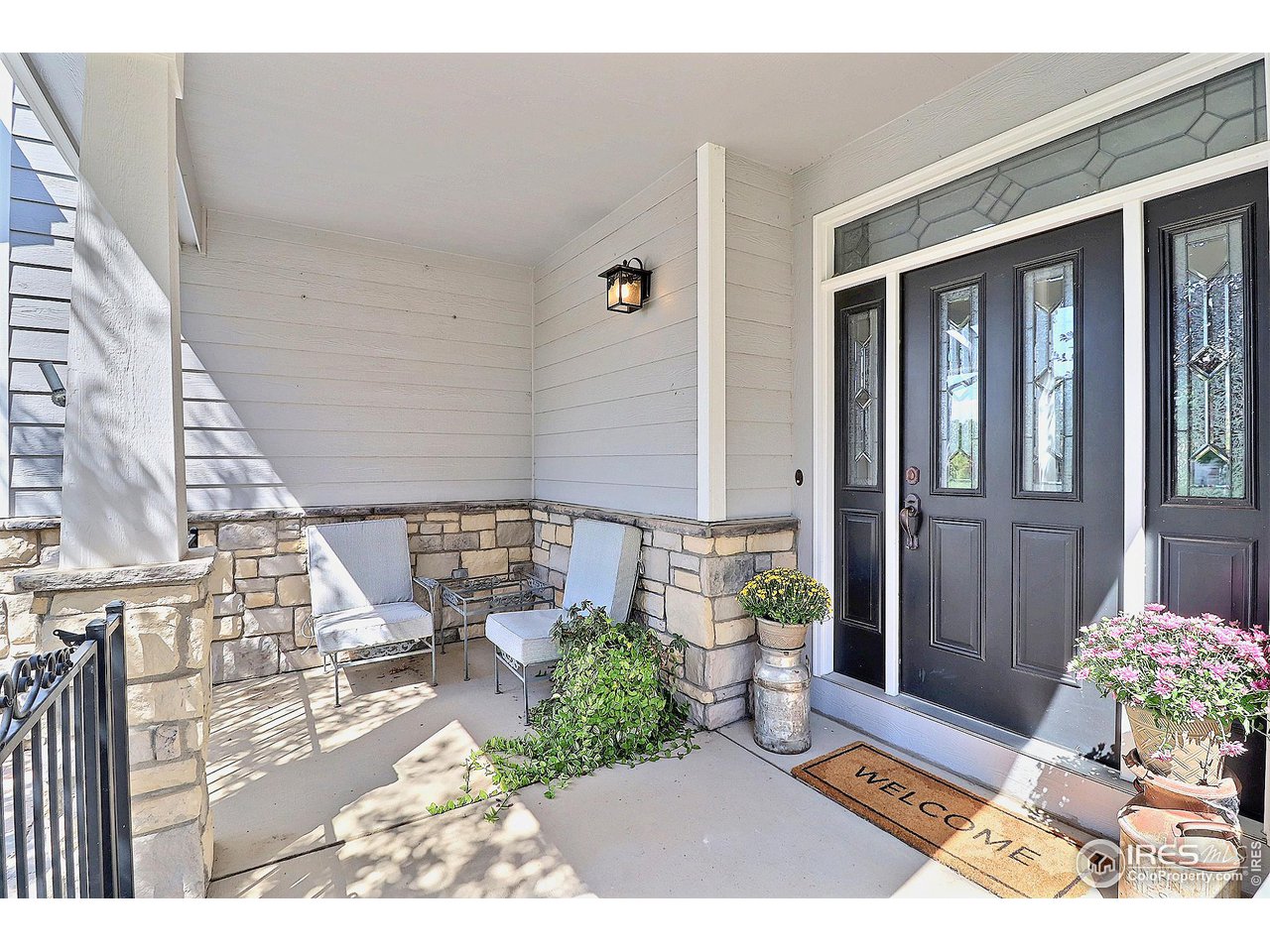6801 West 34th St Road Greeley, CO 80634 - Photo 4 of 40 a view of a porch with chairs and potted plants