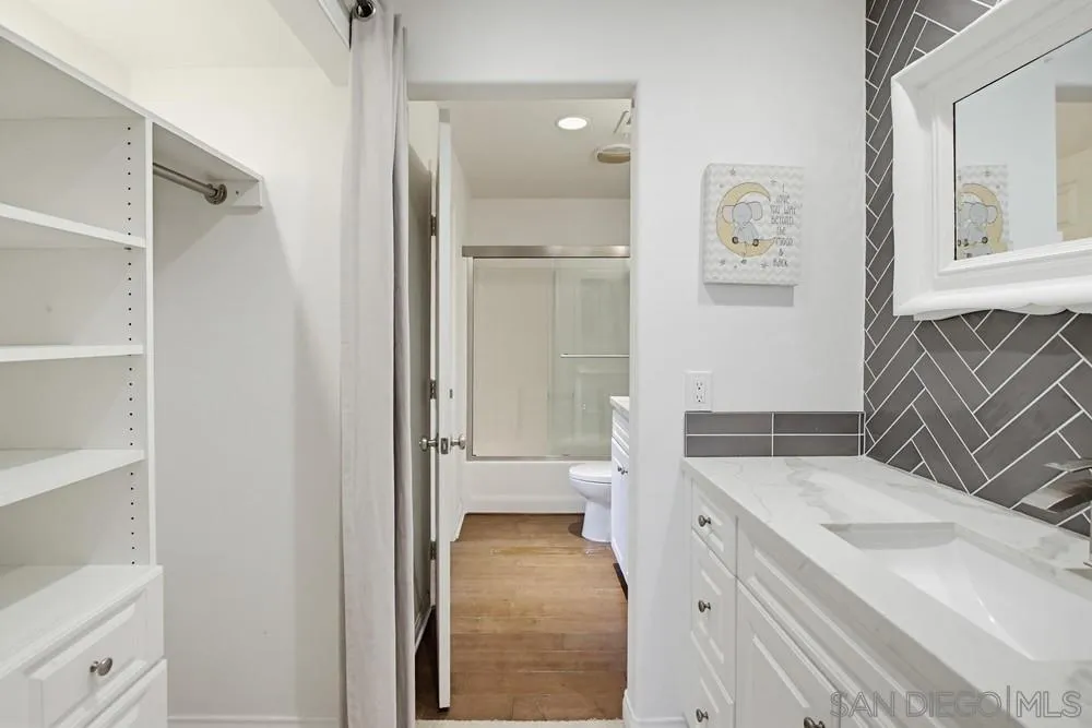 3643 Jetty Point Carlsbad, CA 92010 - Photo 23 of 37 a bathroom with a sink a toilet and shower