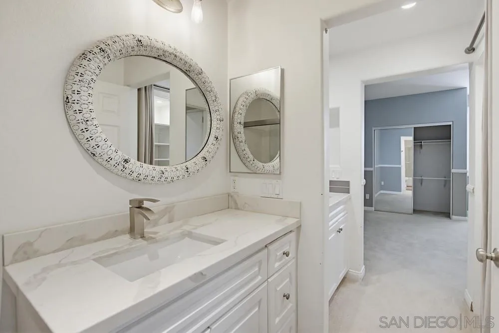 3643 Jetty Point Carlsbad, CA 92010 - Photo 27 of 37 a bathroom with a sink and a mirror
