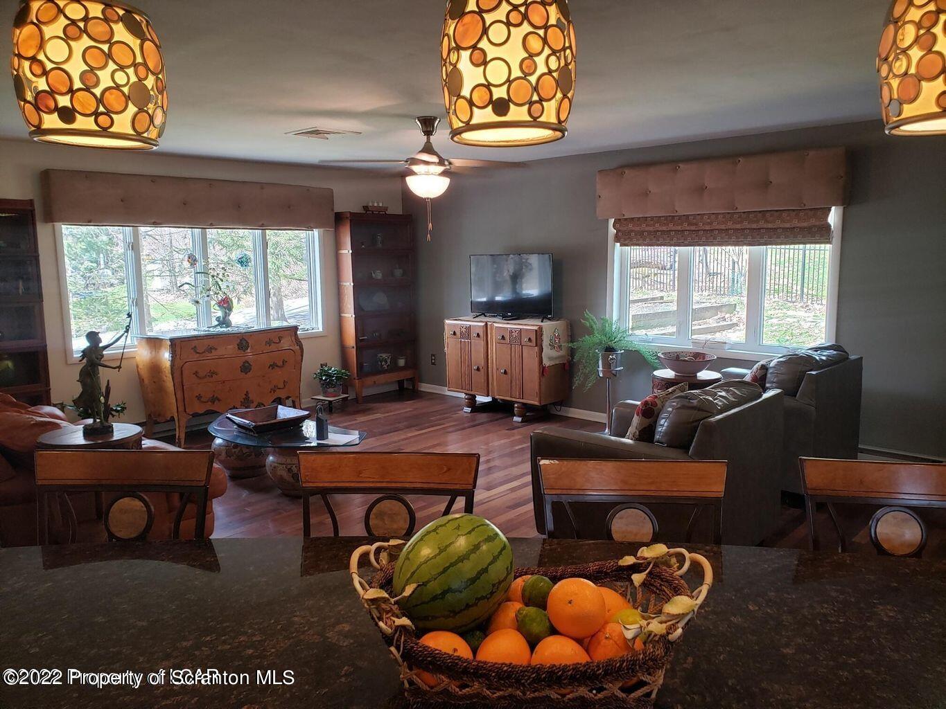 105 Collins Avenue Shavertown, PA 18708 - Photo 13 of 53 a room with furniture a chandelier and a window