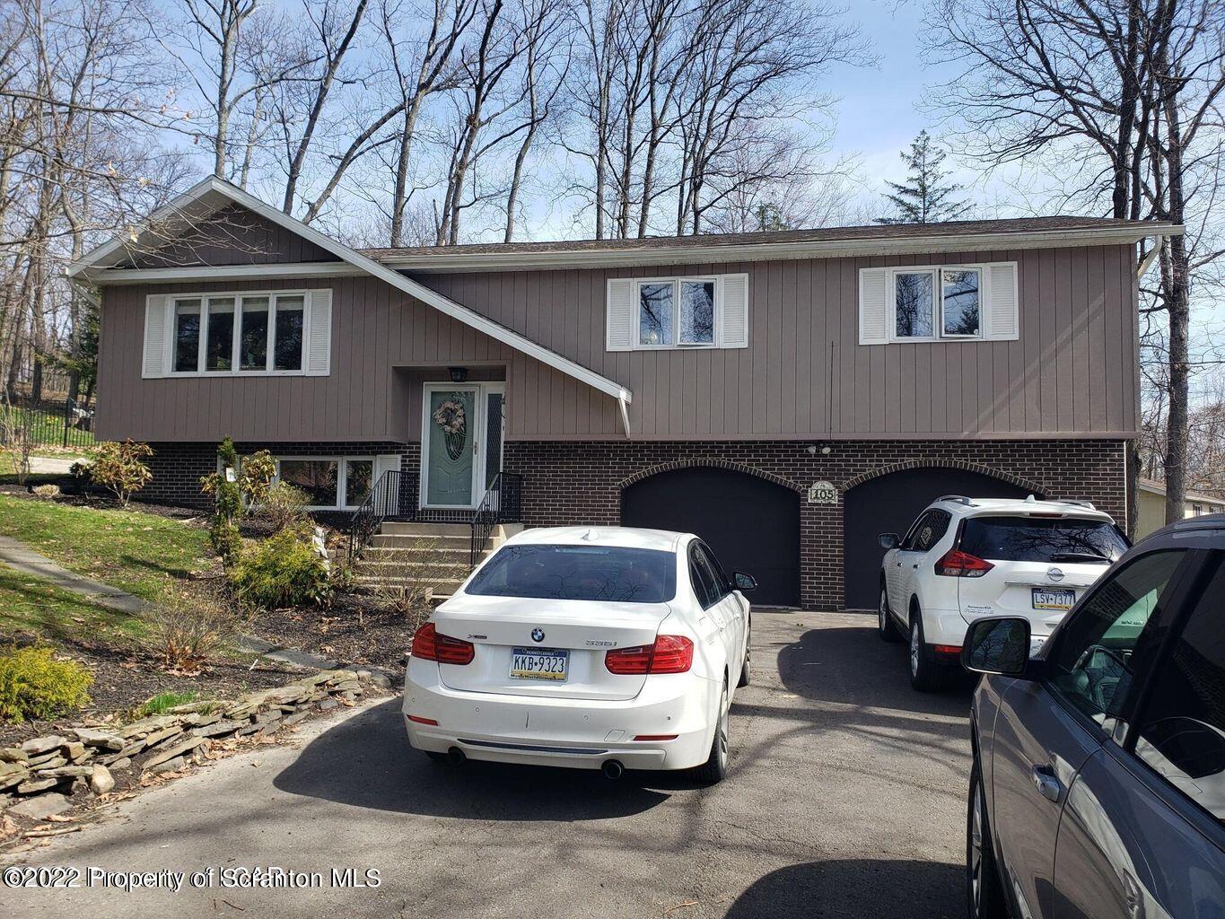 105 Collins Avenue Shavertown, PA 18708 - Photo 2 of 53 a car parked in front of white house