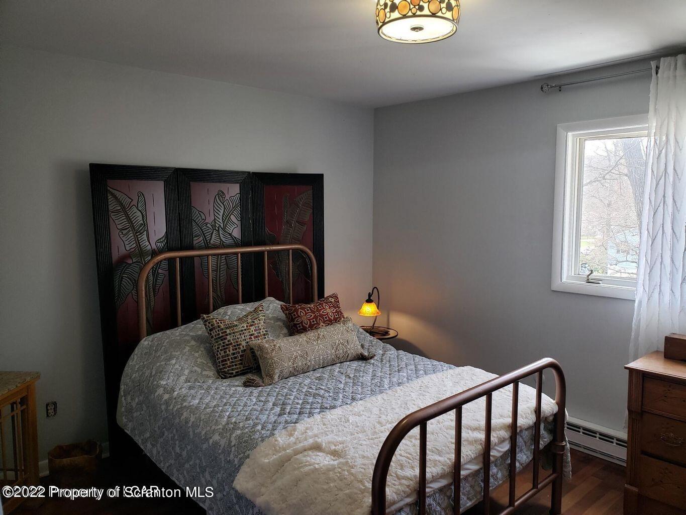 105 Collins Avenue Shavertown, PA 18708 - Photo 32 of 53 a bedroom with a bed and a window