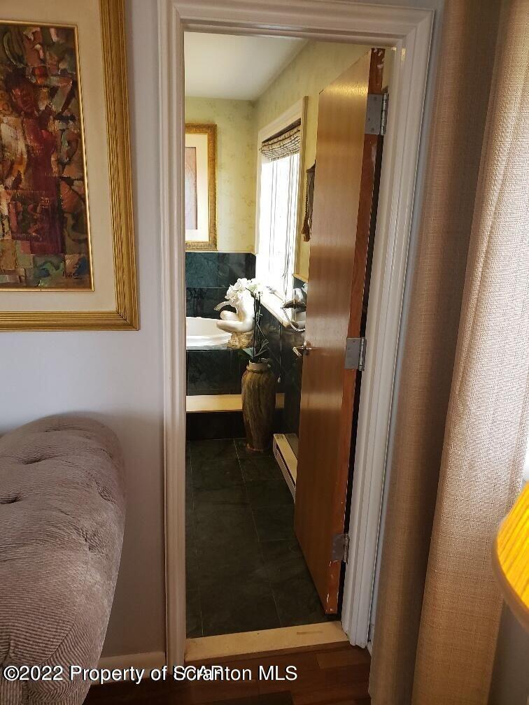 105 Collins Avenue Shavertown, PA 18708 - Photo 37 of 53 a bathroom with a sink a mirror and a shower