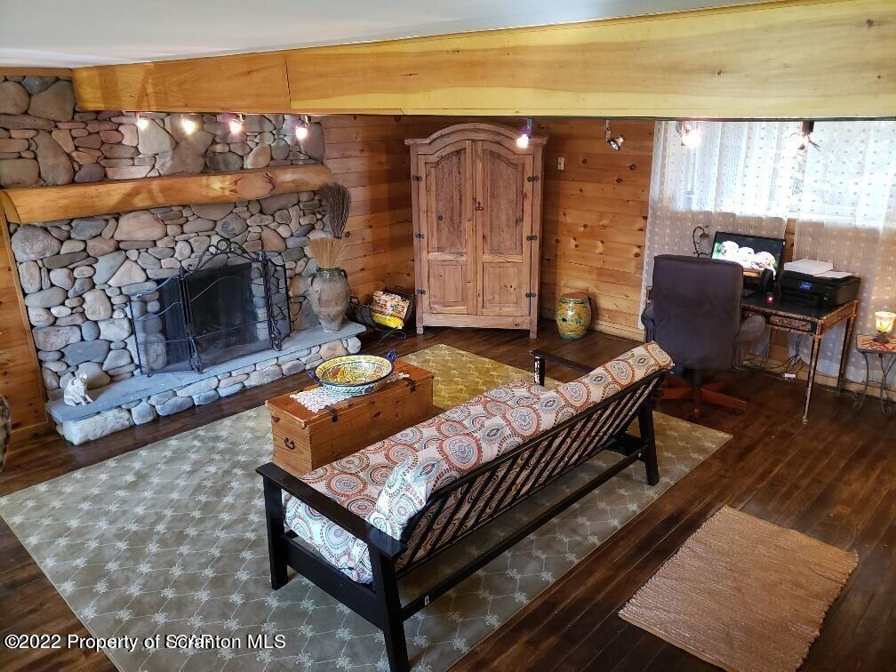 105 Collins Avenue Shavertown, PA 18708 - Photo 41 of 53 a living room with furniture a fireplace and a floor to ceiling window