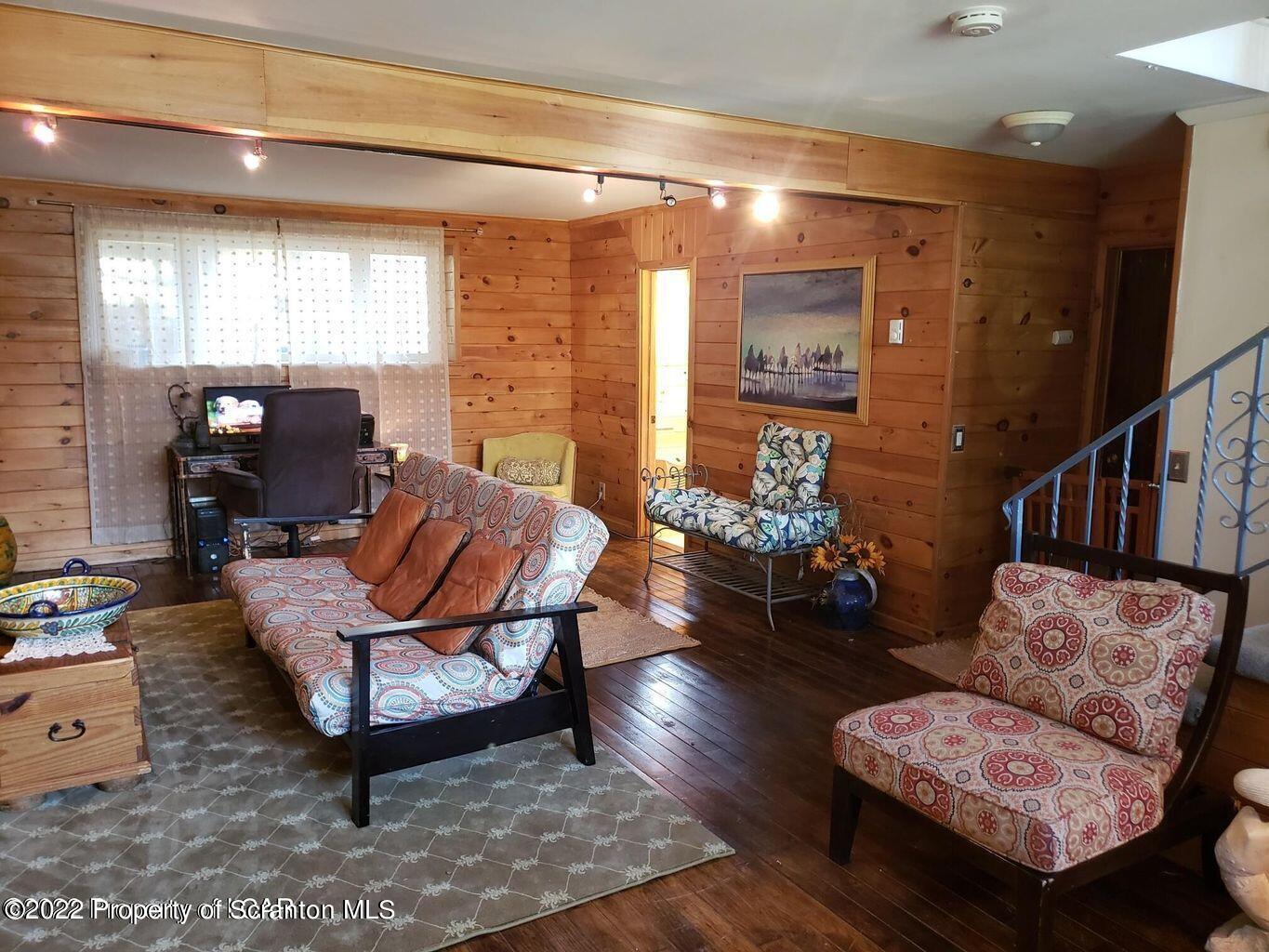 105 Collins Avenue Shavertown, PA 18708 - Photo 43 of 53 a living room with furniture and wooden floor