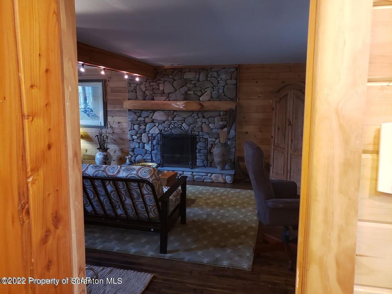 105 Collins Avenue Shavertown, PA 18708 - Photo 53 of 53 a living room with furniture and a fireplace