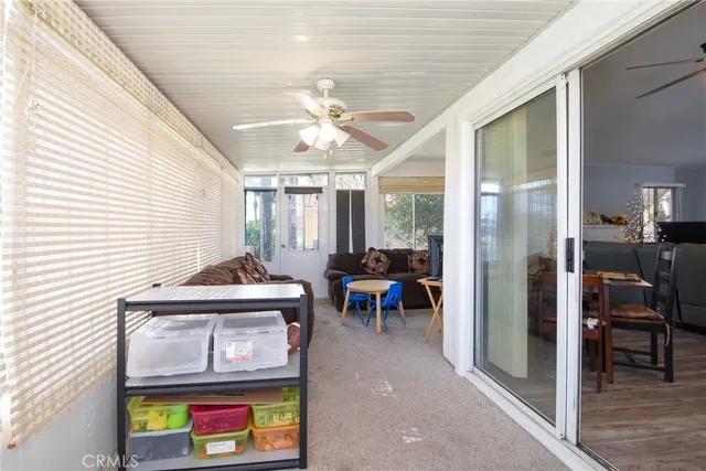 a view of living room with furniture and chandelier