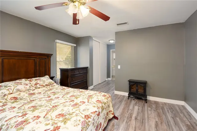 a bedroom with a bed and a dresser