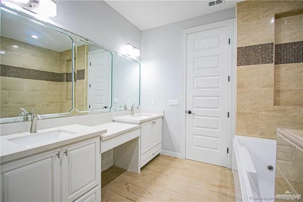 a bathroom with a sink and a mirror