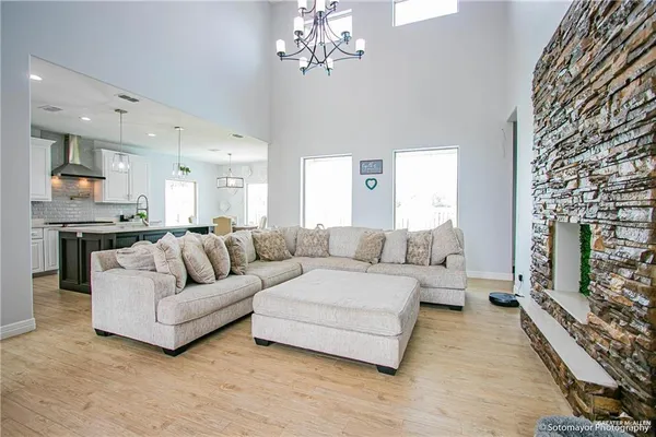 a living room with furniture and a fireplace