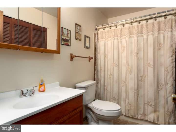 10 Hanover Place Sicklerville, NJ 08081 - Photo 12 of 20 a bathroom with a sink a toilet and shower curtain
