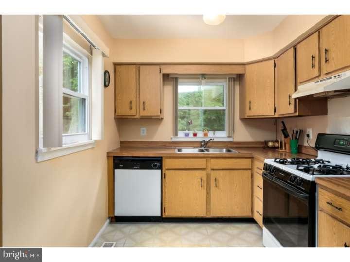 10 Hanover Place Sicklerville, NJ 08081 - Photo 9 of 20 a kitchen with stainless steel appliances granite countertop a stove a sink and a microwave