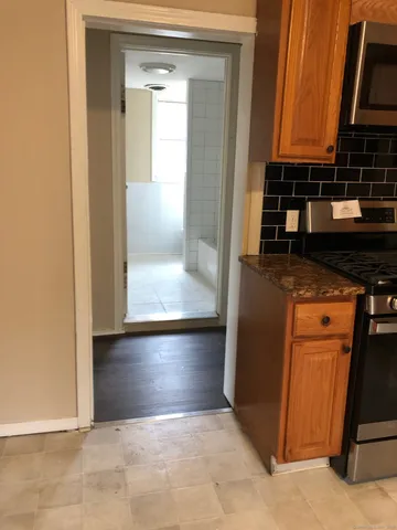 a view of a closet and a cabinet in a room