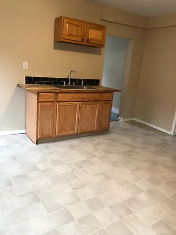a view of a storage & utility room with a sink