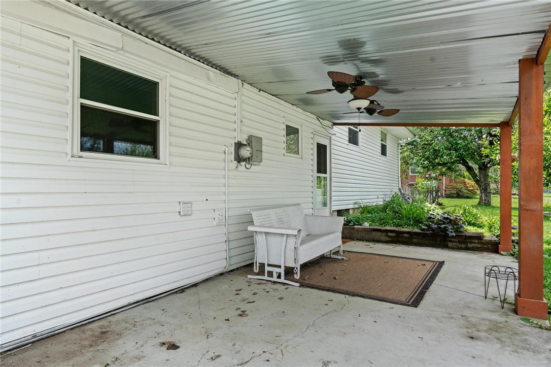 4150 Rose Marie Road Franklin, OH 45005 - Photo 9 of 36 A sheltered concrete patio offers an inviting outdoor living space.