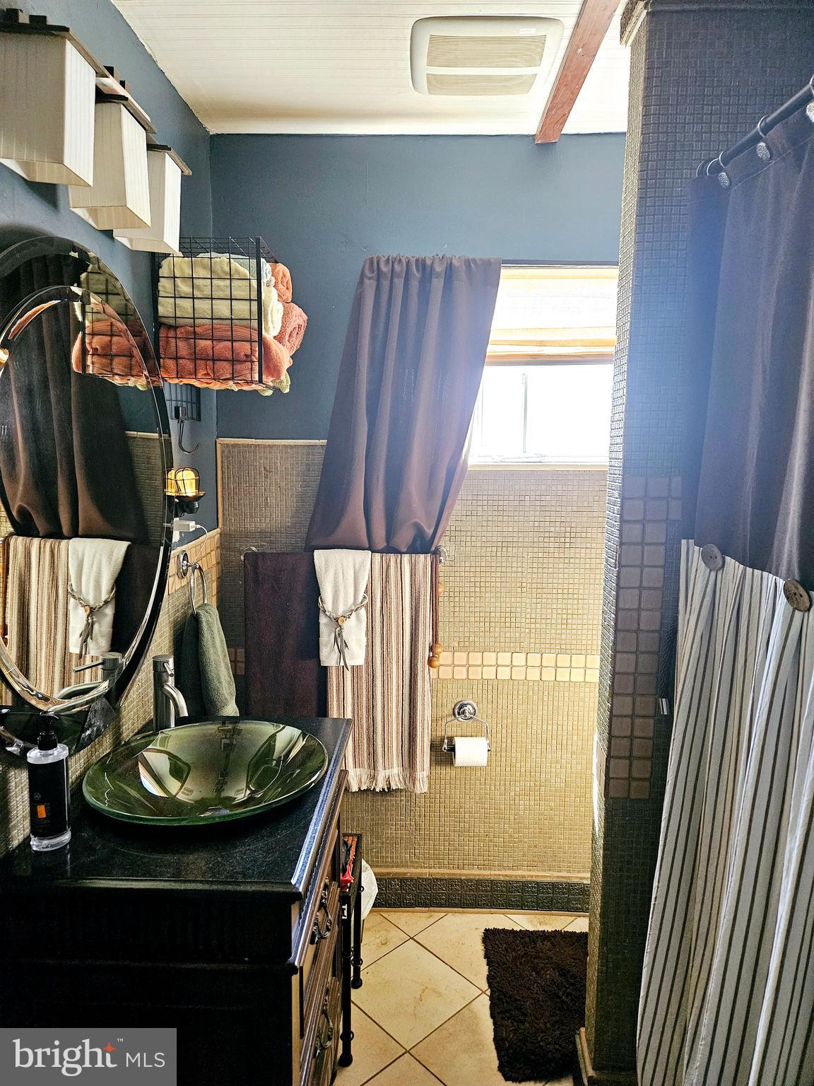 710 Smith Lane Mount Holly, NJ 08060 - Photo 14 of 26 a bathroom with a sink a mirror and next to a window
