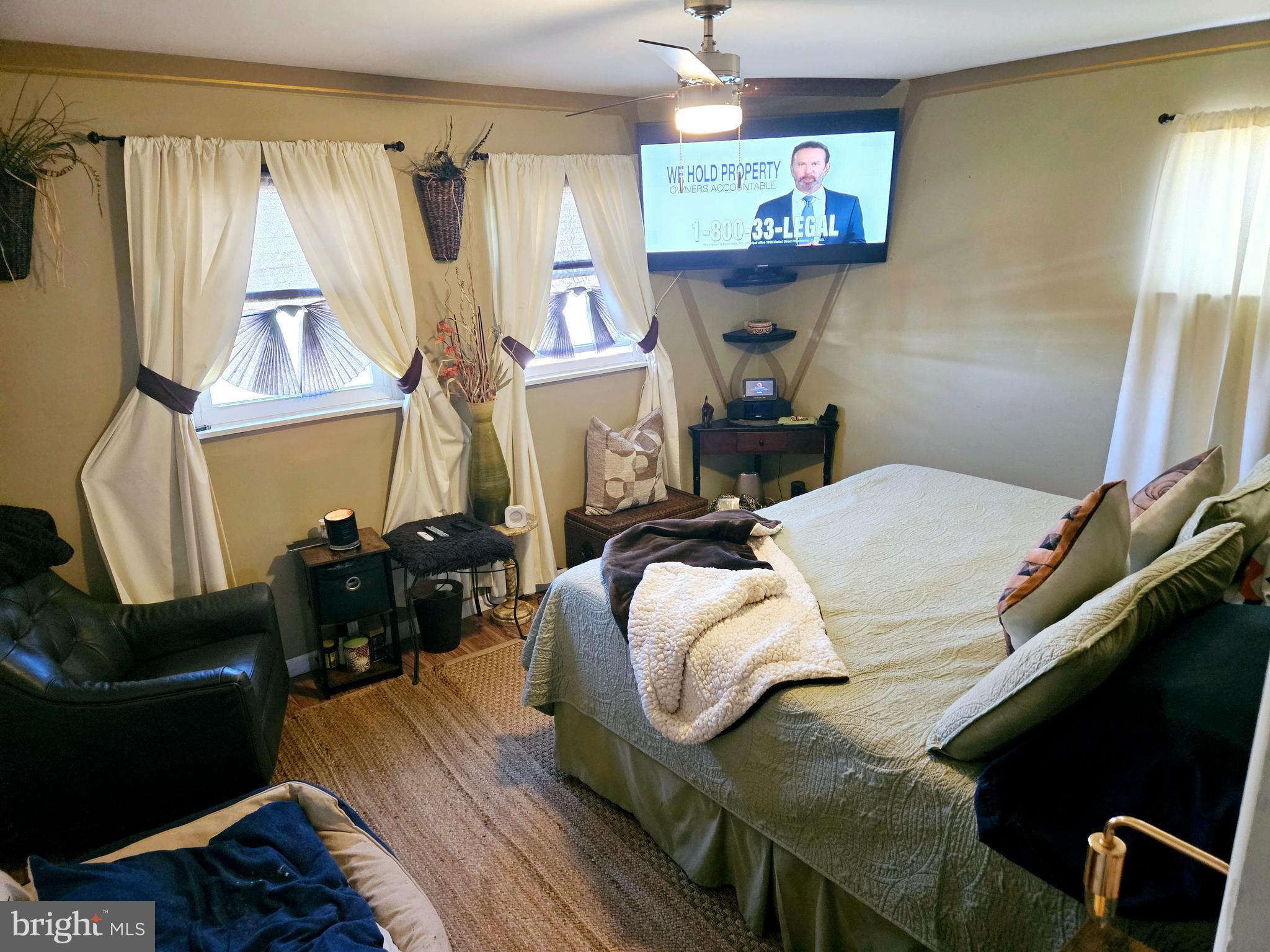 710 Smith Lane Mount Holly, NJ 08060 - Photo 17 of 26 a bed room with a bed and a couch