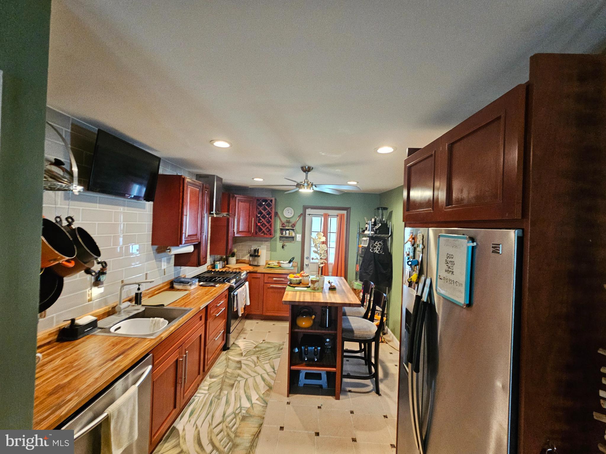710 Smith Lane Mount Holly, NJ 08060 - Photo 3 of 26 a kitchen with stainless steel appliances kitchen island granite countertop a refrigerator and a stove top oven