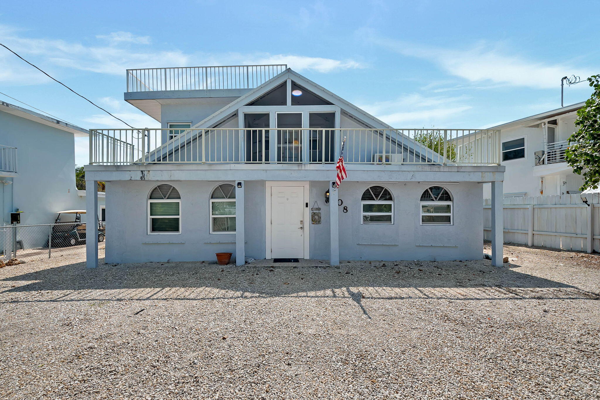 108 Long Ben Drive Key Largo, FL 33037 - Photo 13 of 43 a front view of a house with a yard