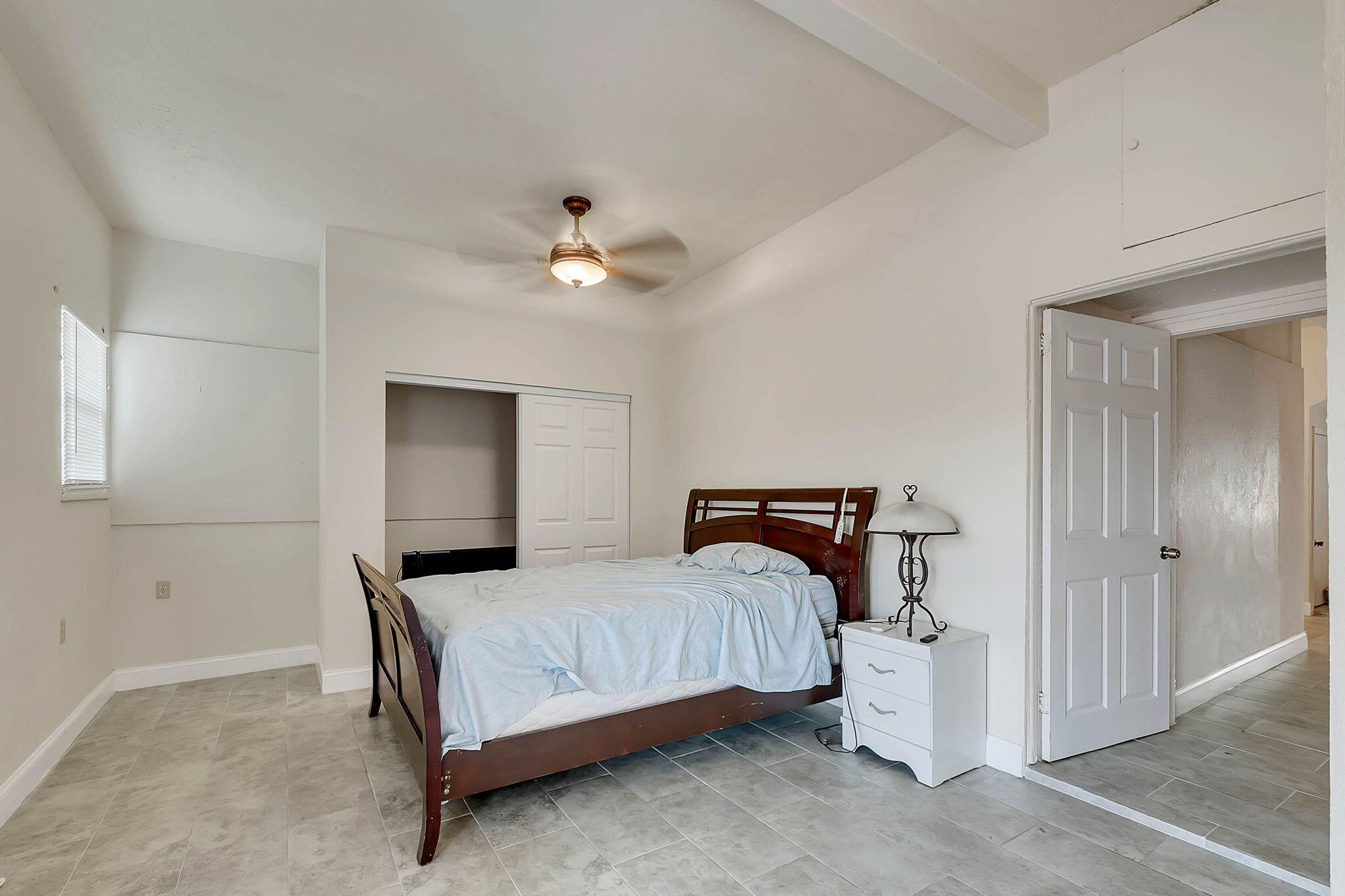 108 Long Ben Drive Key Largo, FL 33037 - Photo 33 of 43 a bedroom with a bed and a chandelier