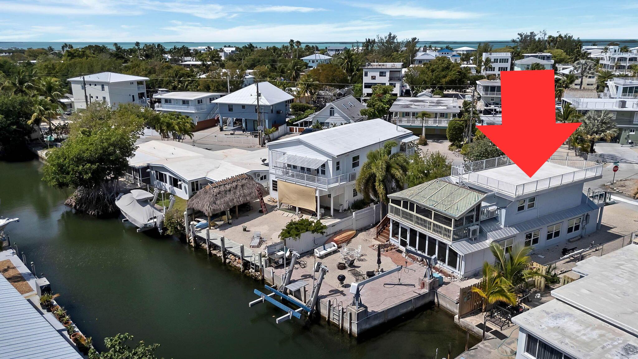 108 Long Ben Drive Key Largo, FL 33037 - Photo 4 of 43 an aerial view of a house with a ocean view