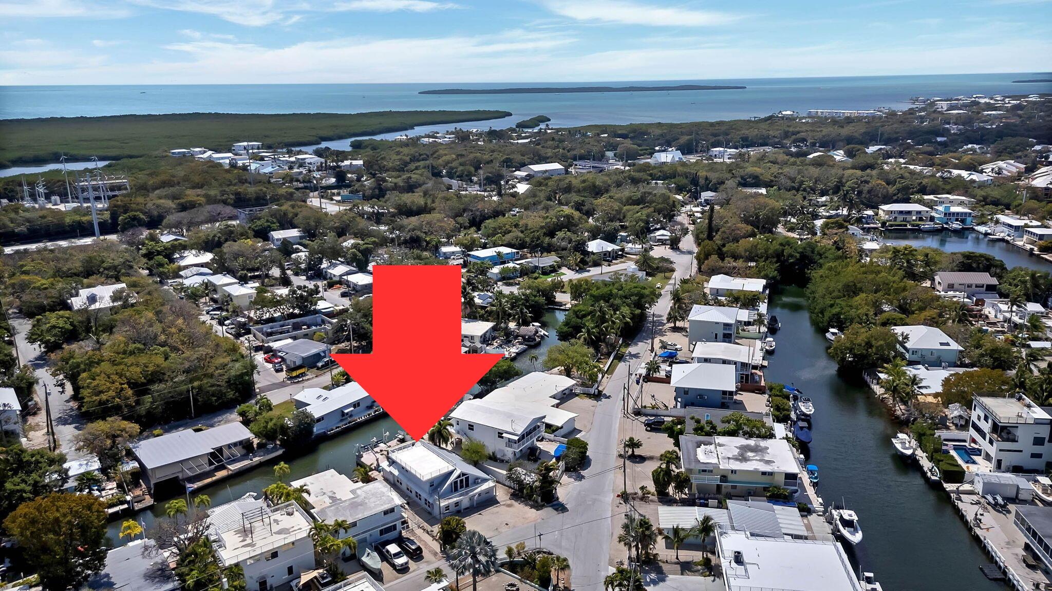 108 Long Ben Drive Key Largo, FL 33037 - Photo 6 of 43 an aerial view of a city with lots of residential buildings