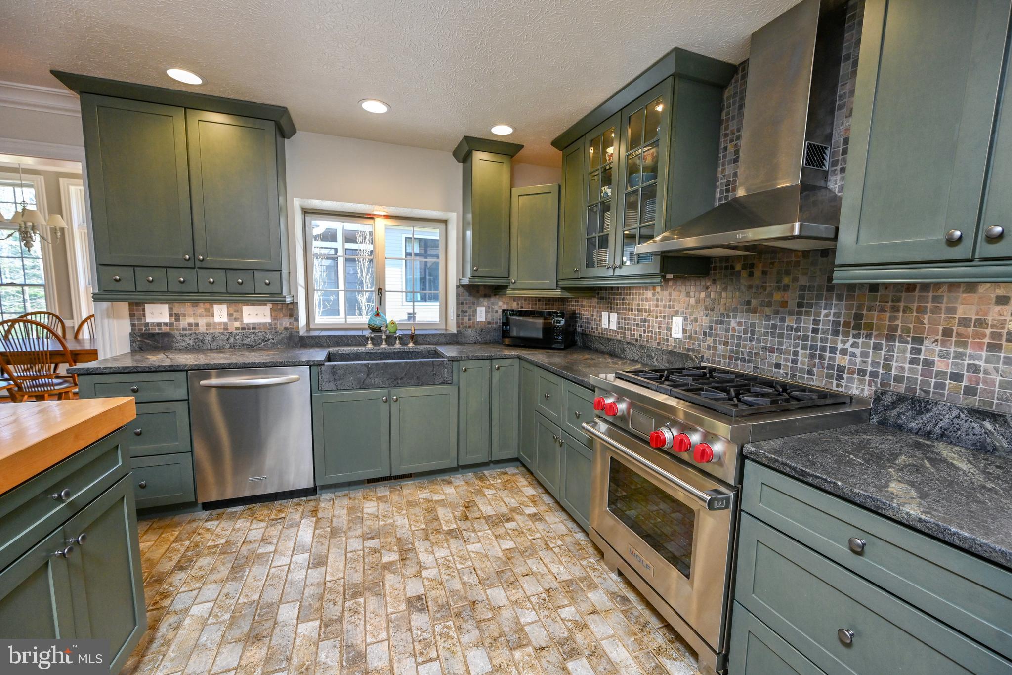56 Bee Tree Lane Oakland, MD 21550 - Photo 20 of 139 Custom tile back splash with soapstone countertop.