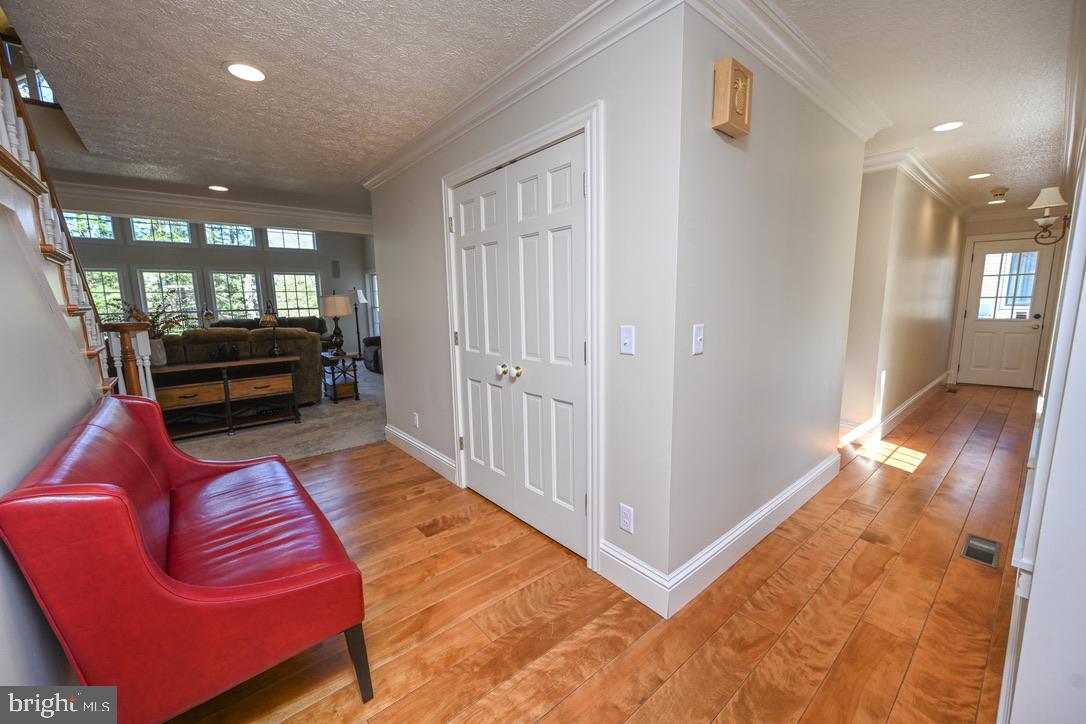 56 Bee Tree Lane Oakland, MD 21550 - Photo 62 of 139 Leading to kitchen, 1/2 bath, laundry & suite.