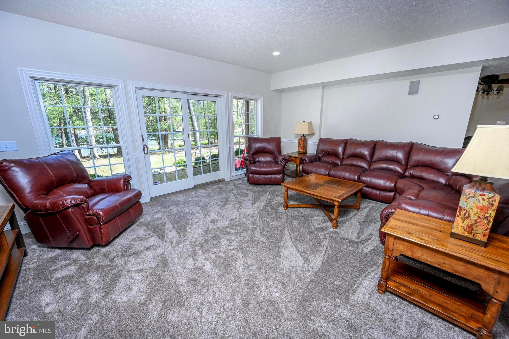 56 Bee Tree Lane Oakland, MD 21550 - Photo 79 of 139 Glass wall looking out at the lake.