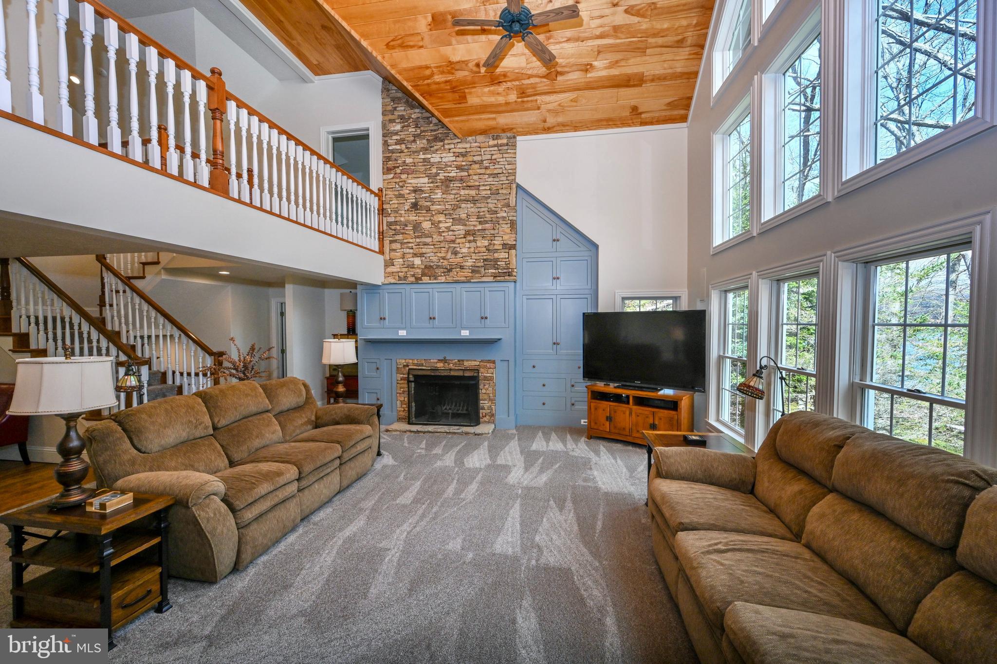 56 Bee Tree Lane Oakland, MD 21550 - Photo 9 of 139 Stone WB FP, surrounded by built in wood cabinet.